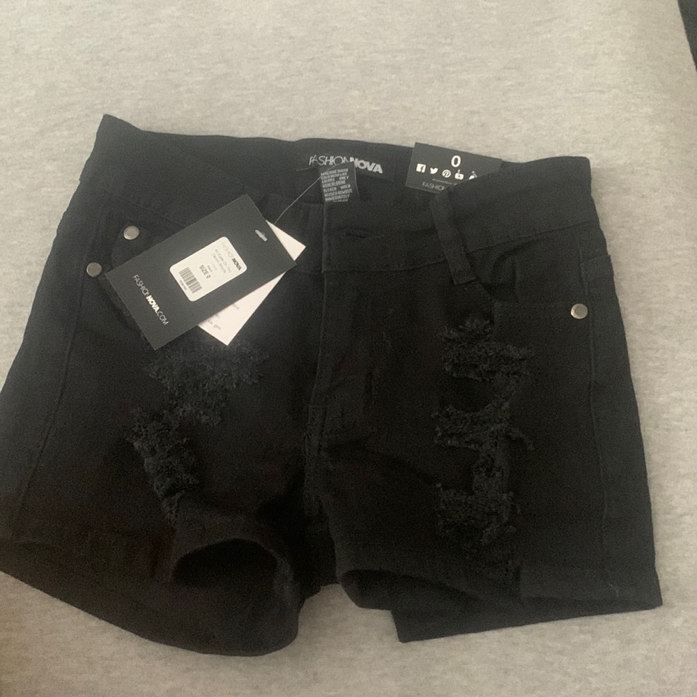 Black distressed shorts